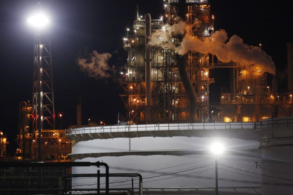 Emissions rise from the Valero Energy Corp. St. Charles Refinery at night in Norco, Louisiana, U.S. Photographer: Luke Sharrett/Bloomberg