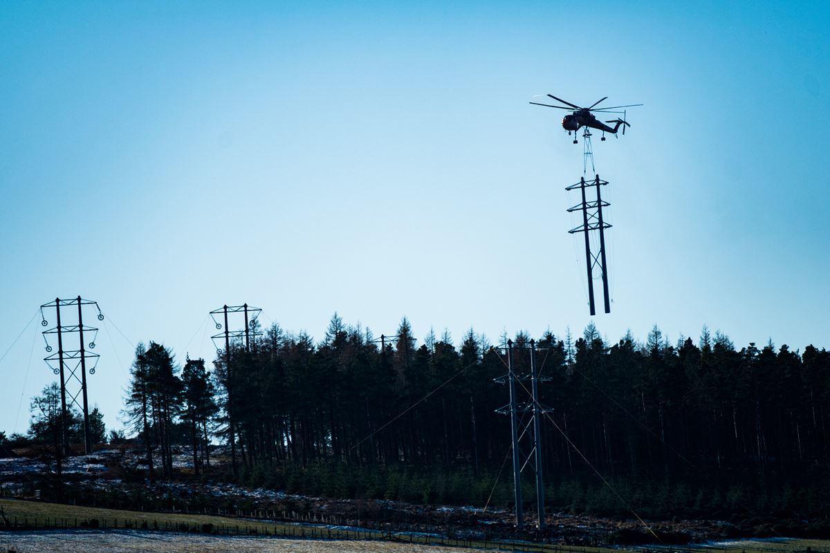 The Erickson S-64 Air Crane chopper installing poles for the Dorenell wind farm