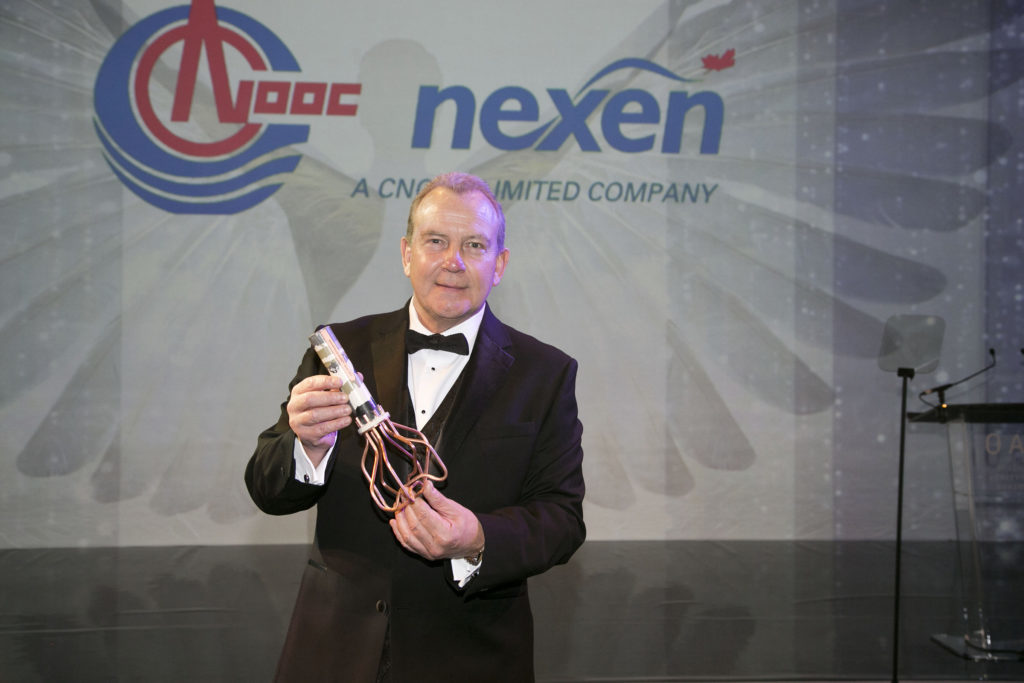 Ray Riddoch with his award