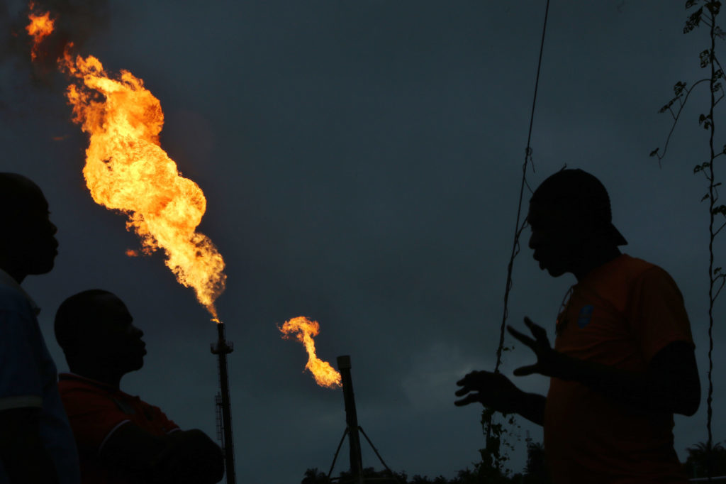 Gas flares burn from pipes at an oil flow station operated by Nigerian Agip Oil Co. Ltd. (NAOC), a division of Eni SpA, in Idu, Rivers State, Nigeria, on Monday, Sept. 28, 2015.  Photographer: George Osodi/Bloomberg