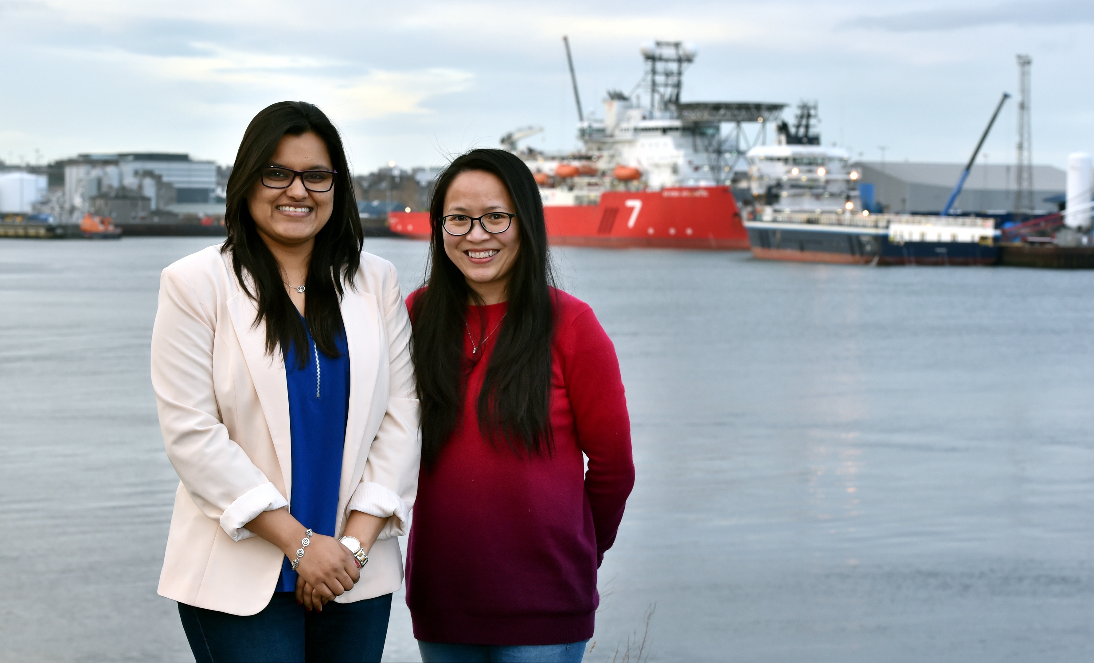 Ritika Pawar (left) and Lien Ta with Aberdeen Harbour in the background.
Picture by COLIN RENNIE February 16, 2018.