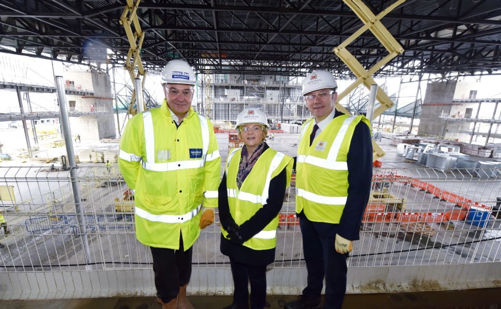 Work continues on the new AECC in Aberdeen as the building programme passes the halfway stage. (from left) Nigel Munro, regional project manager at Henry Boot Development, Aberdeen City Council Co-Leader Councillor Jenny Laing and Co-Leader Douglas Lumsden.
Picture by COLIN RENNIE  March 13, 2018.