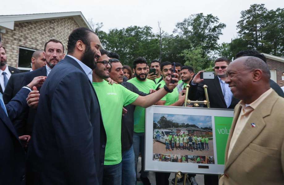 His Royal Highness Crown Prince Mohammed bin Salman smiles at volunteers at a Habitat for Humanity home Saturday, April 7, 2018, in Houston. His Royal Highness Crown Prince Mohammed bin Salman visited a habitat for humanity home that aided Harvey victims and was supported by donations by the Aramco, the Saudi oil company. ( Steve Gonzales / Houston Chronicle )