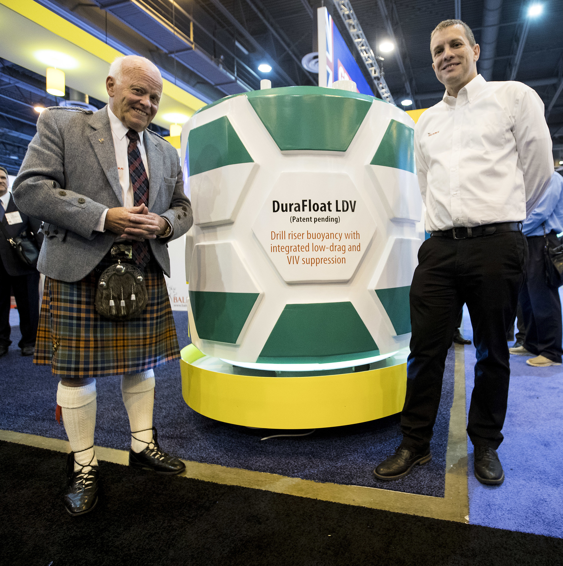 Jim Milne, managing director, Balmoral Group, left, and Fraser Milne, engineering and projects director of Balmoral Offshore Engineering, pose for a photo after unveiling the Durafloat LDV, deepwater riser buoyancy system, during the 50th Offshore Technology Conference on Monday, April 30, 2018, in Houston. ( Brett Coomer / Houston Chronicle )