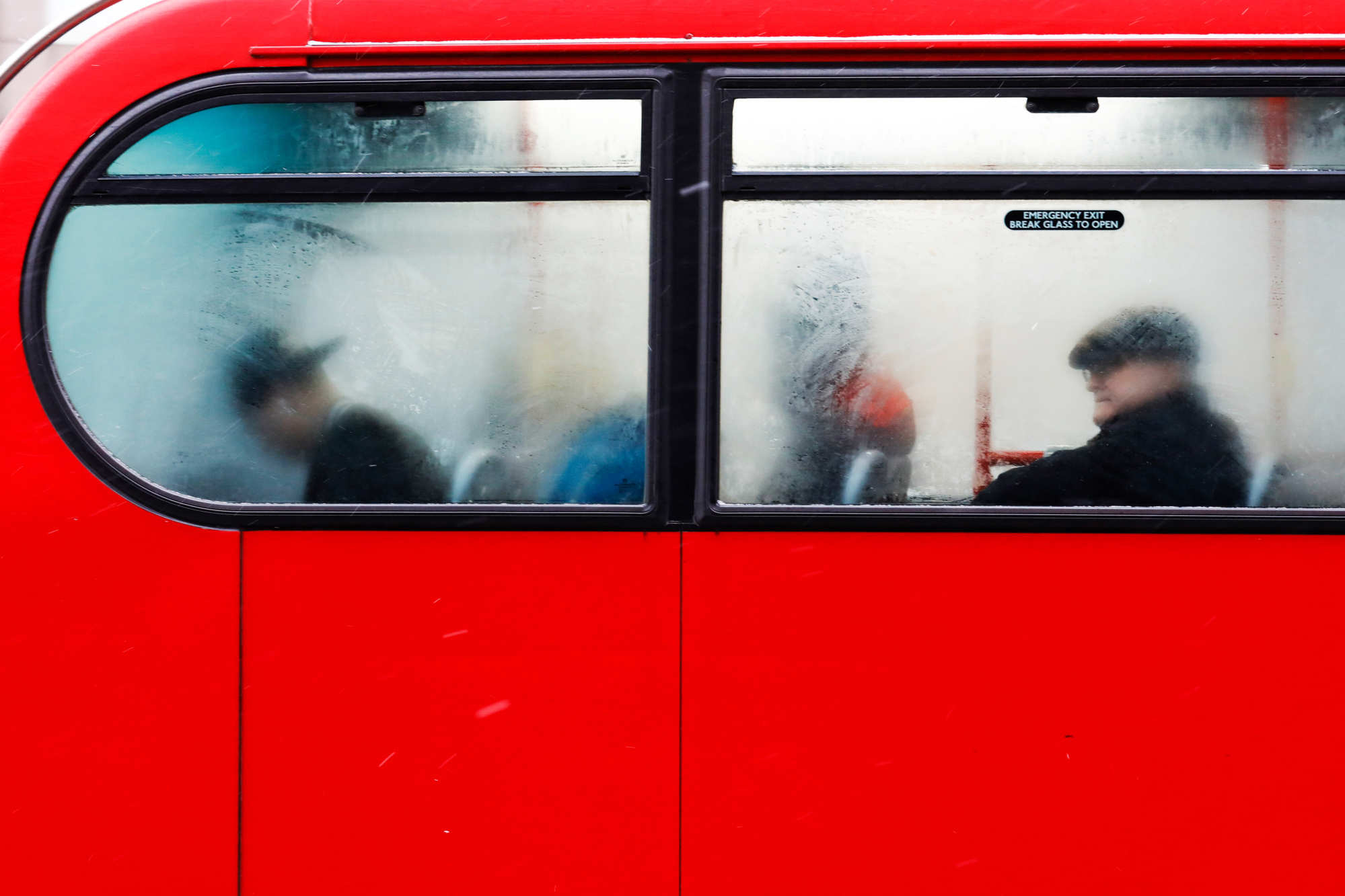 Commuters ride on a bus in London, U.K., on Thursday, March 1, 2018. The freezing weather entrenched across much of Europe is stretching Britain's supply of natural gas with fresh snowfall forecast for much of the country. Photographer: Luke MacGregor/Bloomberg