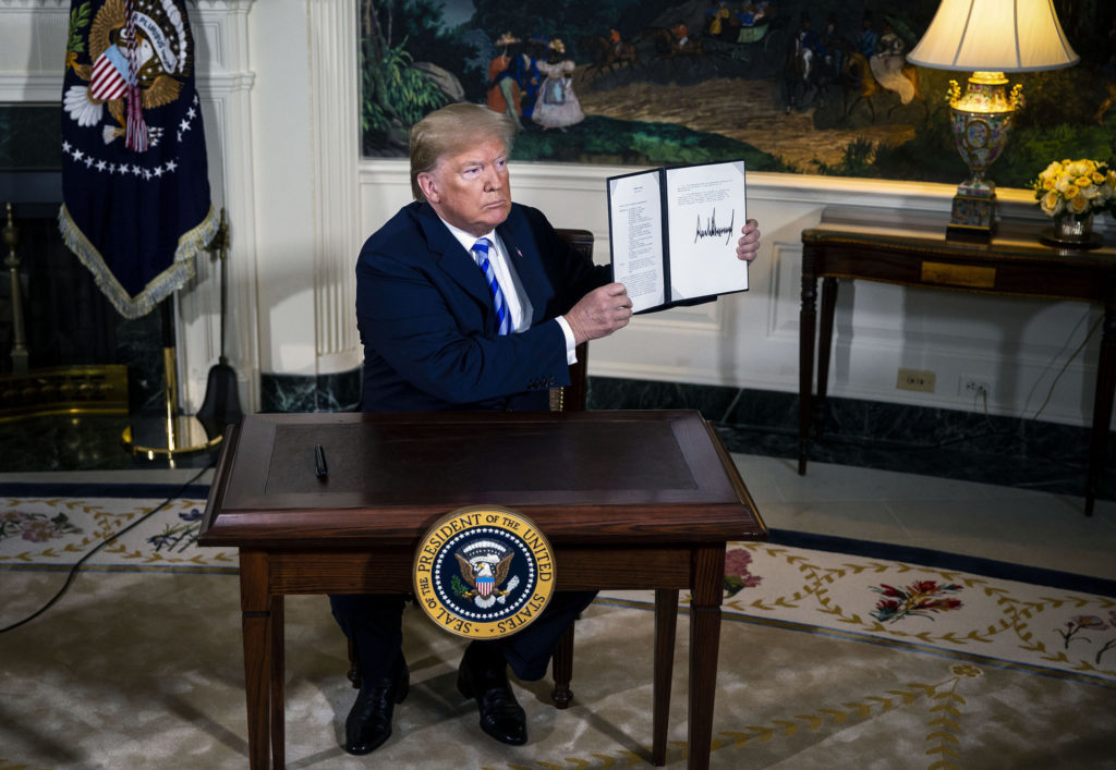 U.S. President Donald Trump displays a signed Presidential Memorandum after speaking during an announcement in the Diplomatic Room of the White House in Washington, D.C., U.S., on Tuesday, May 8, 2018. Photographer: Al Drago/Bloomberg