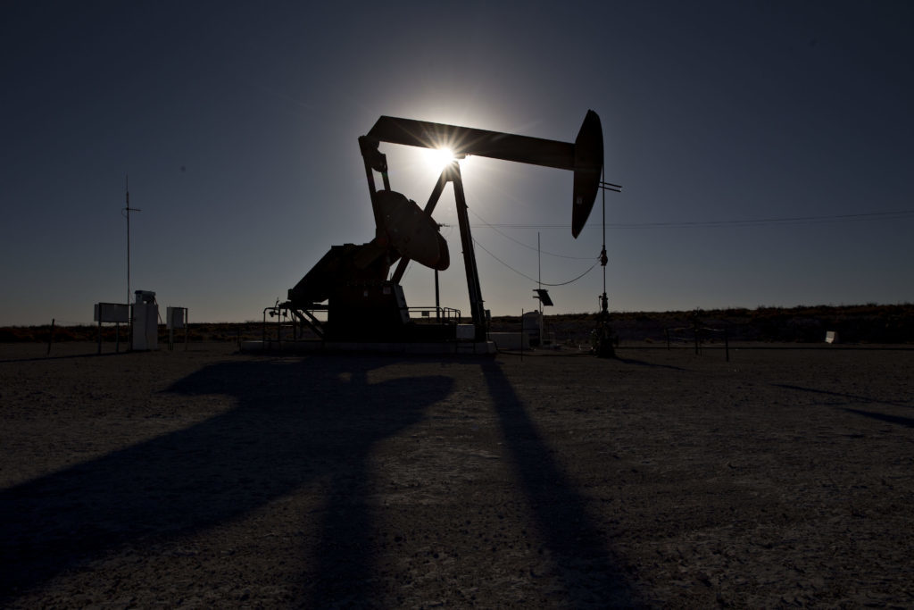 The silhouette of an oil pump jack is seen in Texas, U.S. Photographer: Bloomberg Creative Photos/Bloomberg