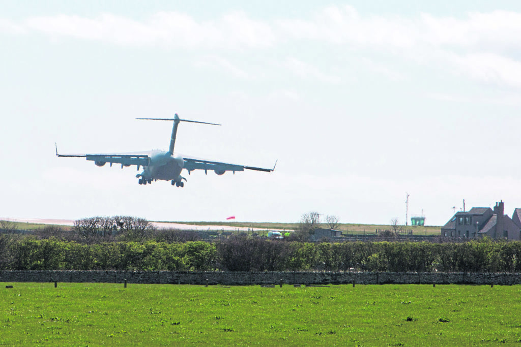 The United States Air Force C-17 Globemaster, at Wick John O,Groats Airport on Saturday morning, where containers containing highly enriched uranium, where loaded for a flight to the USA. This is the third flight from Wick, over the past year. After taking of from Wick the Globemaster  heads for RAF Lossiemouth where it takes on fuel for the flight to America. Photo: Robert MacDonald/Northern Studios. 5 May 2018