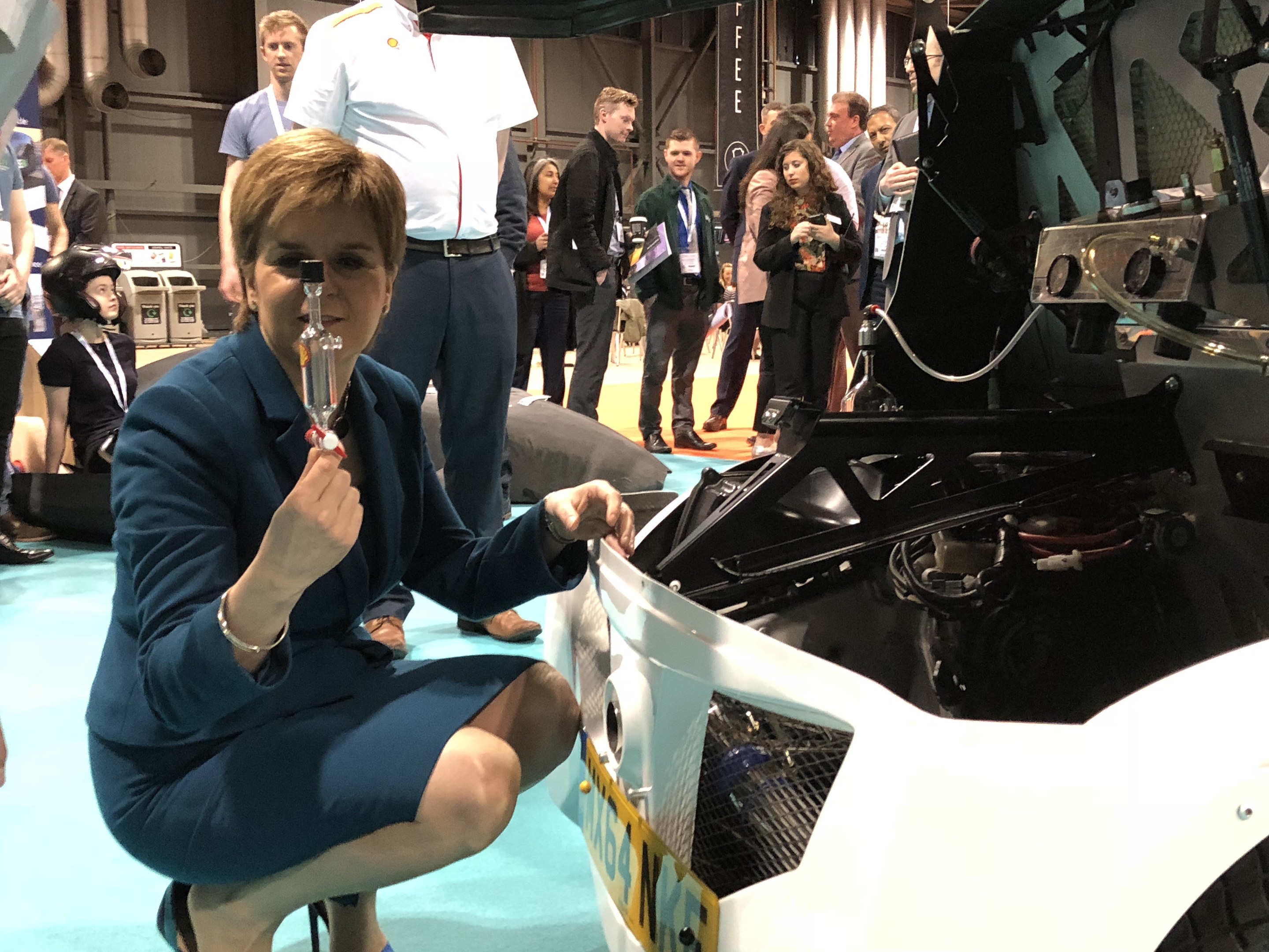 First Minister Nicola Sturgeon inspects Shell's electric vehicle.