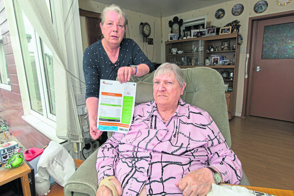 Thurso woman Mabel Patricia Polson, Durness Street, with her daughter Dorcas Sinclair and the Extra Energy statement showing an overpayment of almost £3000.