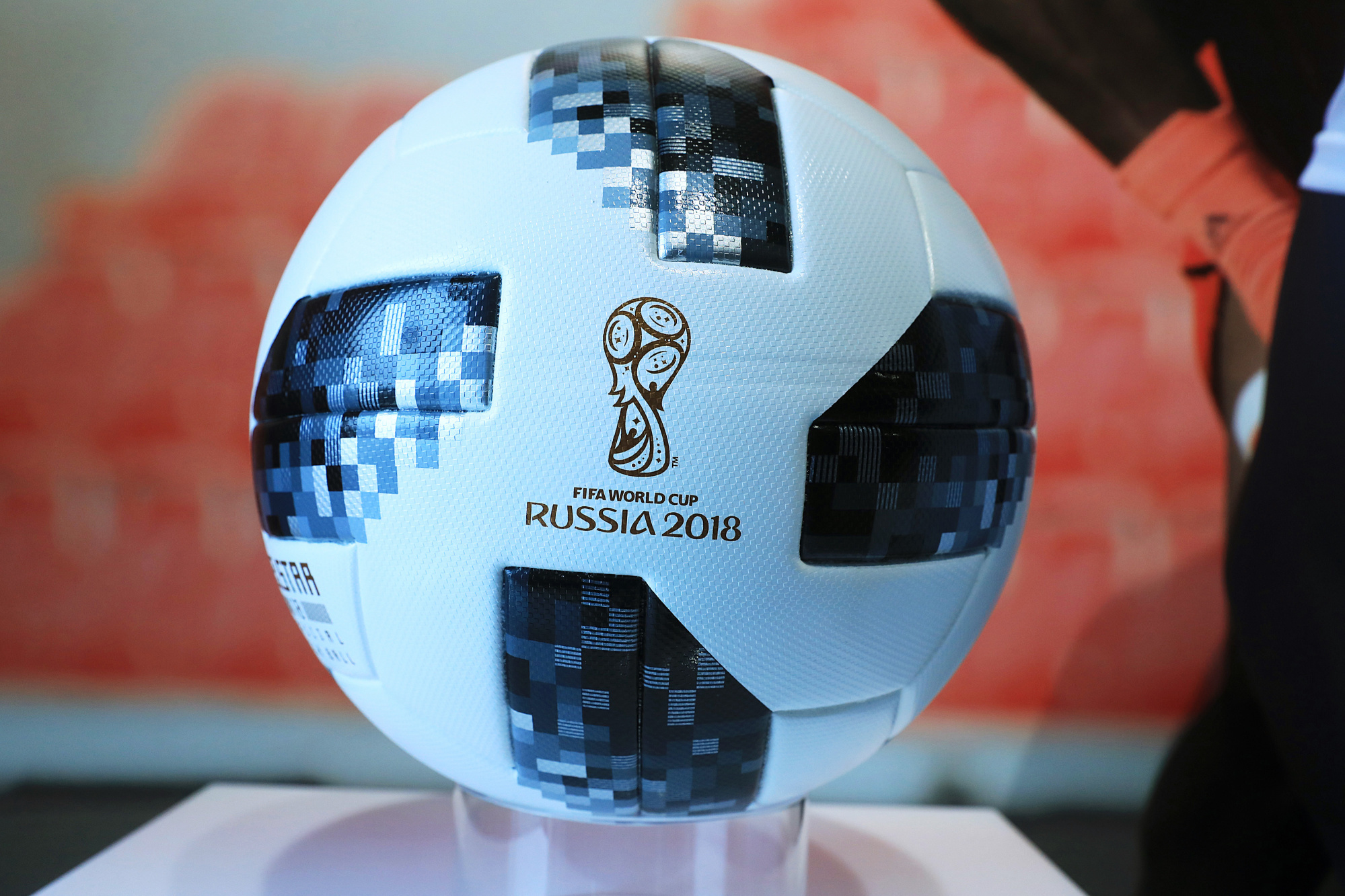 An official Adidas AG 2018 FIFA World Cup Russia soccer ball sits on display during the company's annual results announcement in Herzogenaurach, Germany, on Wednesday, March 14, 2018. Photographer: Krisztian Bocsi/Bloomberg