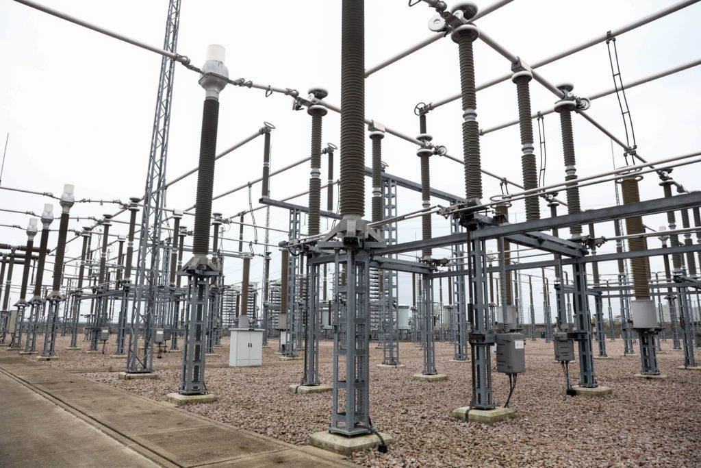 Cables hang from electricity pylons at the BritNed interconnector near Rochester. Photographer: Chris Ratcliffe/Bloomberg