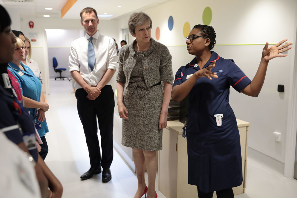 Prime Minister Theresa May and Secretary of State for Health and Social Care Jeremy Hunt meet nurses during a tour of the Royal Free Hospital, north London following the announcement of  increased NHS funding. PRESS ASSOCIATION Photo. Picture date: Monday June 18, 2018. Later in a speech she outlined how spending on the health service will grow by £384 million a week in real terms by 2024. See PA story POLITICS NHS. Photo credit should read: Dan Kitwood/PA Wire