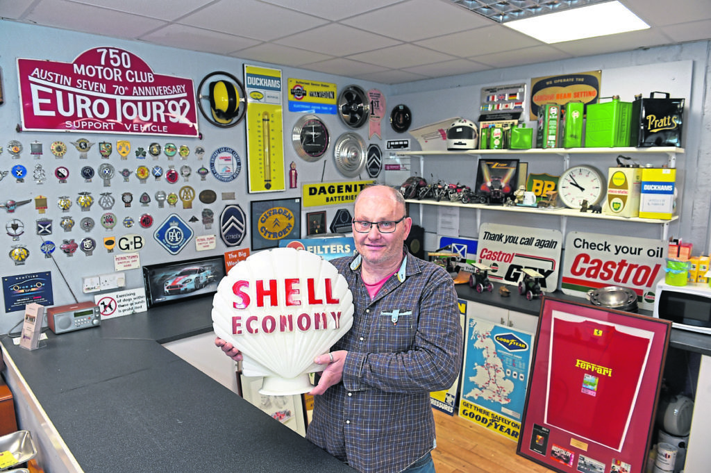 FUNDRAISING:  Smile Scotland co-founder and trustee Clive Hampshire with some of the lots. Photograph by Kenny Elrick