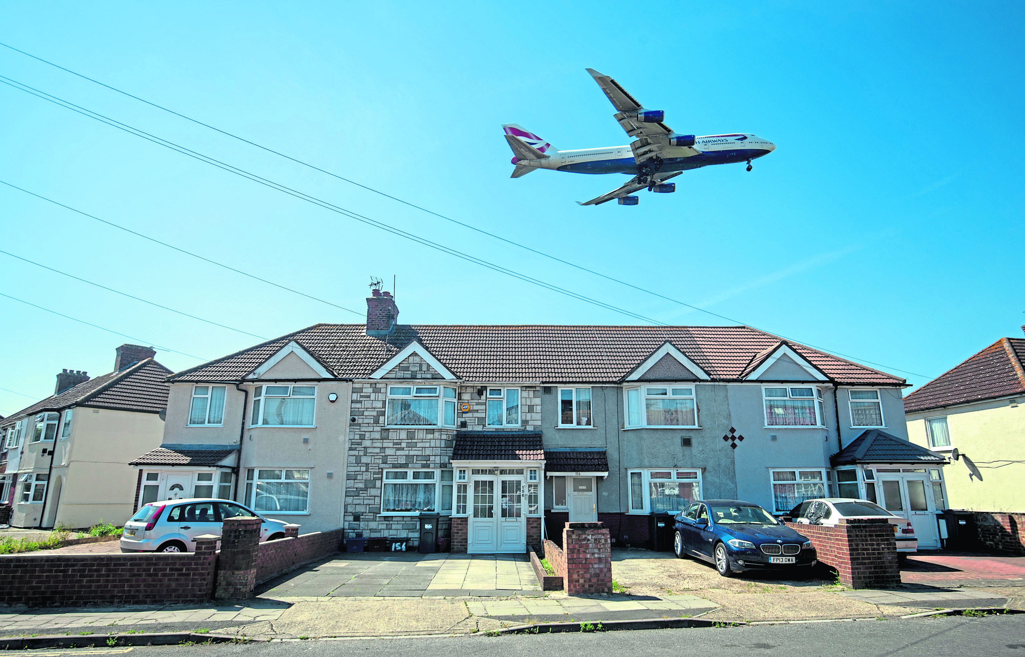 sky-high: A plane lands at Heathrow Airport ahead of a vote in parliament which will decide whether or not it should have a third runway