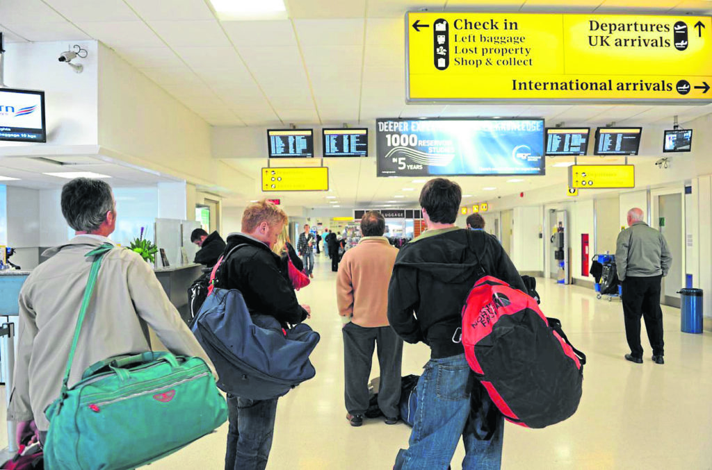 Aberdeen Airport.



Passengers check the boards to see what flights will be leaving.



Photograph by Tim Allen



25/05/11