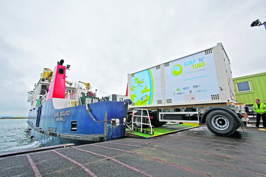The Surf N Turf hydrogen project in Orkney: The Surf N Turf moile storage unit goes onto an Eday boat