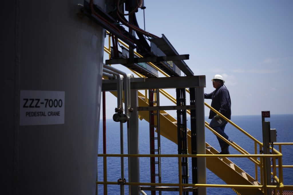 A offshore worker climbs a staircase aboard the Chevron Corp. Jack/St. Malo deepwater oil platform in the Gulf of Mexico off the coast of Louisiana, U.S., on Friday, May 18, 2018. While U.S. shale production has been dominating markets, a quiet revolution has been taking place offshore. The combination of new technology and smarter design will end much of the overspending that's made large troves of subsea oil barely profitable to produce, industry executives say. Photographer: Luke Sharrett/Bloomberg