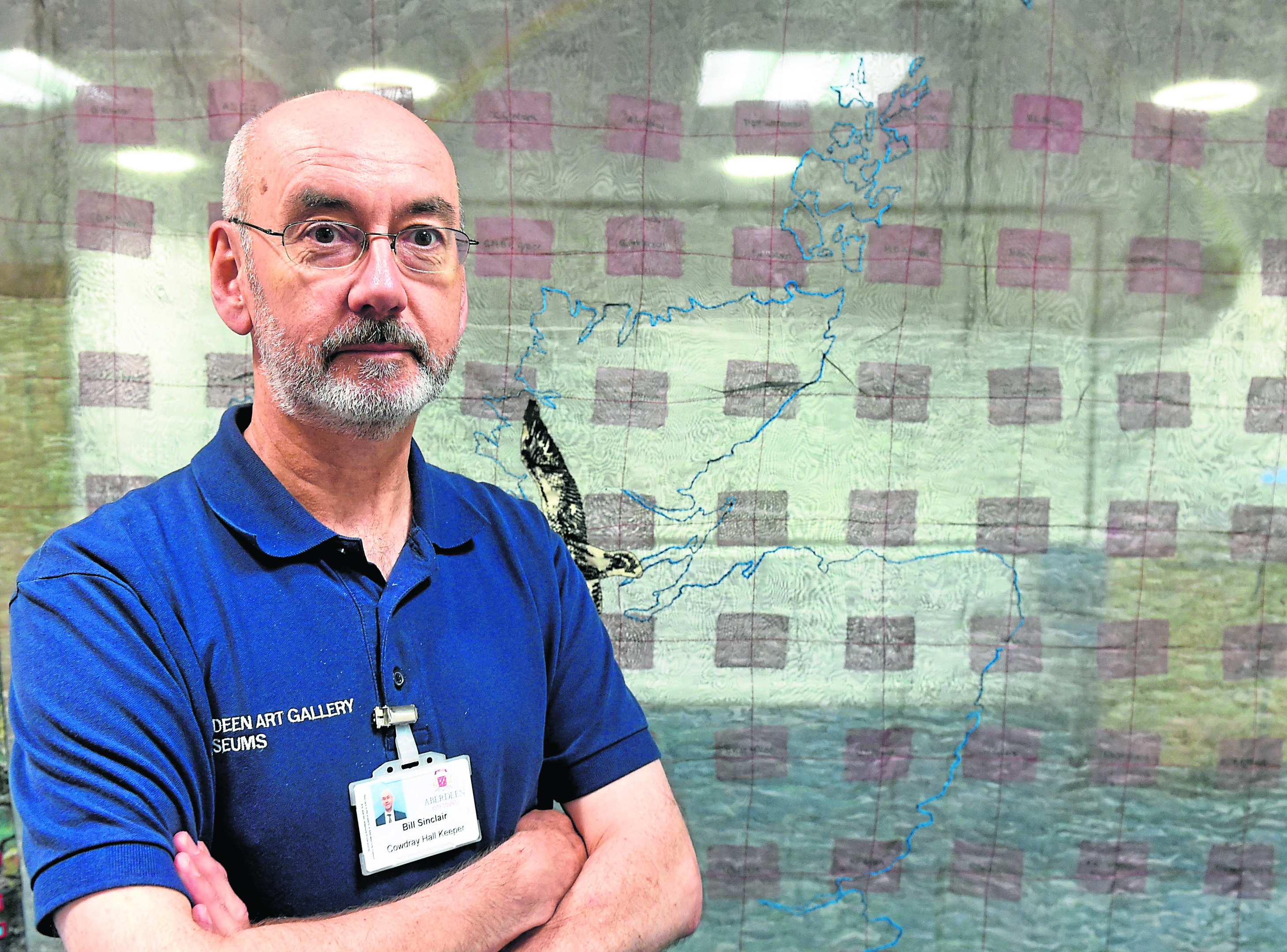 A banner made by Julie Montgarret for the Piper Alpha disaster 30 years ago, is on show at the Aberdeen Maritme Museum, Aberdeen. In the picture is Bill Sinclair from the museum.