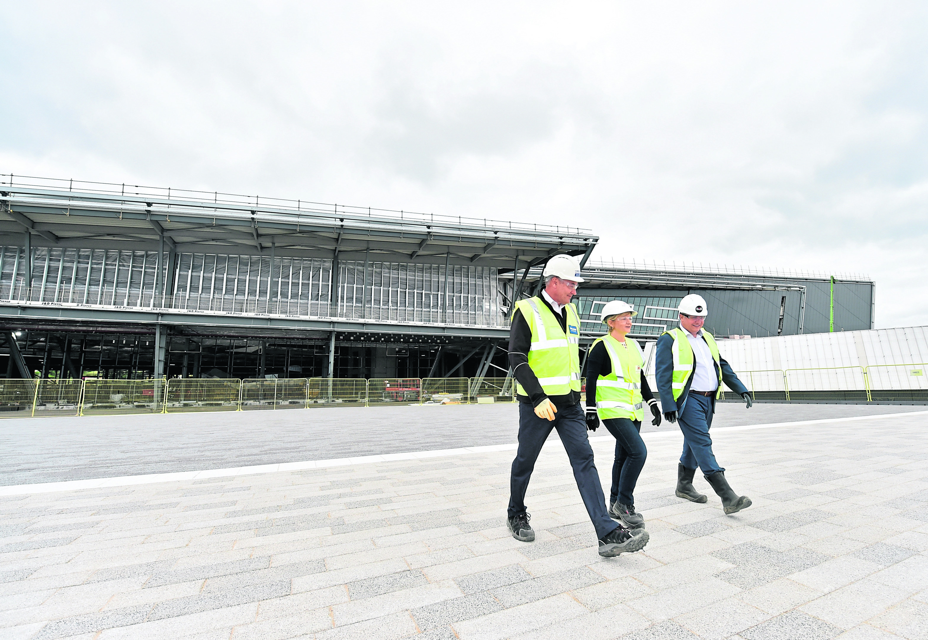 New name for AECC announced, Dyce, Aberdeen. 9th July 2018.

Pictured are Nigel Munro (Project Director at Henry Boot Developments) Cllr Jenny Laing (Co-Leader of Aberdeen City Council), Nick Waight (Managing Director of AECC) walking in front of the new AECC.


Picture by Scott Baxter    09/07/2018