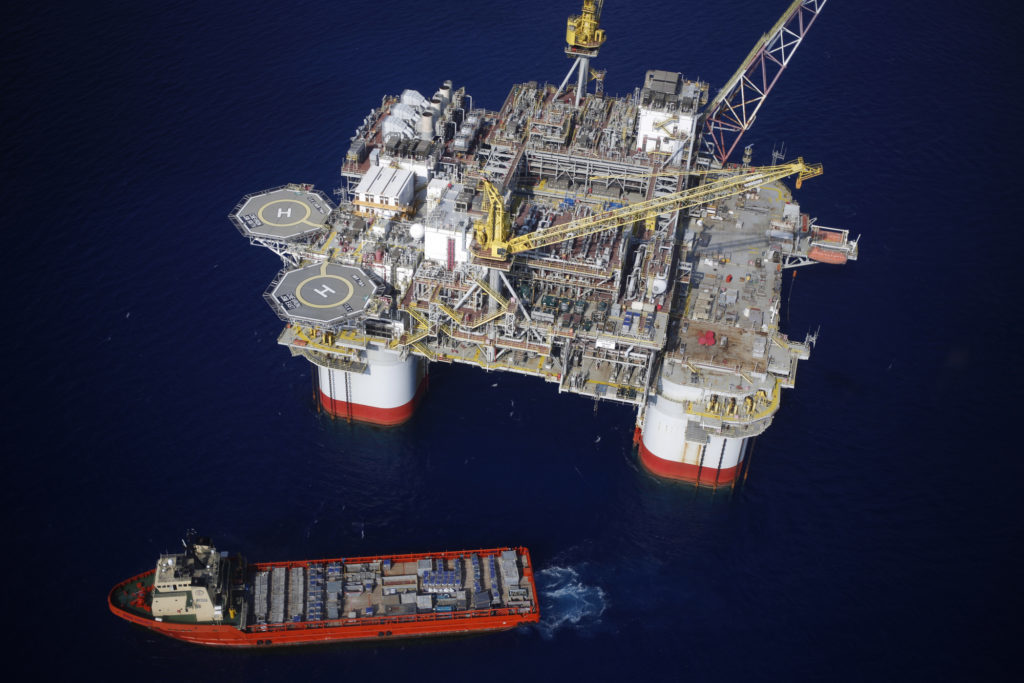 The Kobe Chouest platform supply vessel sits anchored next to the Chevron Corp. Jack/St. Malo deepwater oil platform in the Gulf of Mexico in the aerial photograph taken off the coast of Louisiana, U.S., on Friday, May 18, 2018. Photographer: Luke Sharrett/Bloomberg