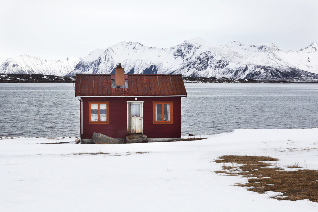 A house sits on the island of Lofoten, Norway, on Thursday, April 2, 2009.  Photographer: HEID WIDEROE/Bloomberg