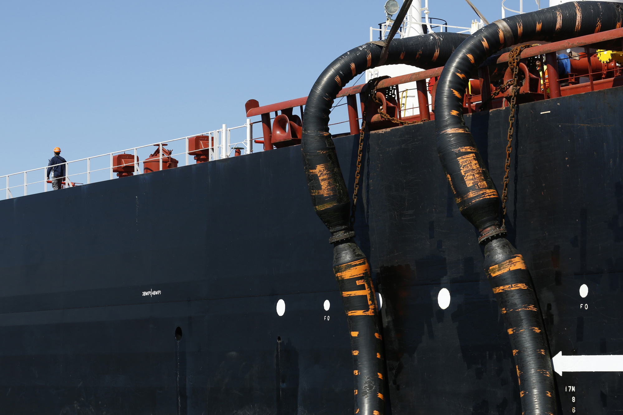 Oil pipes connect the oil tanker. Photographer: Luke MacGregor/Bloomberg