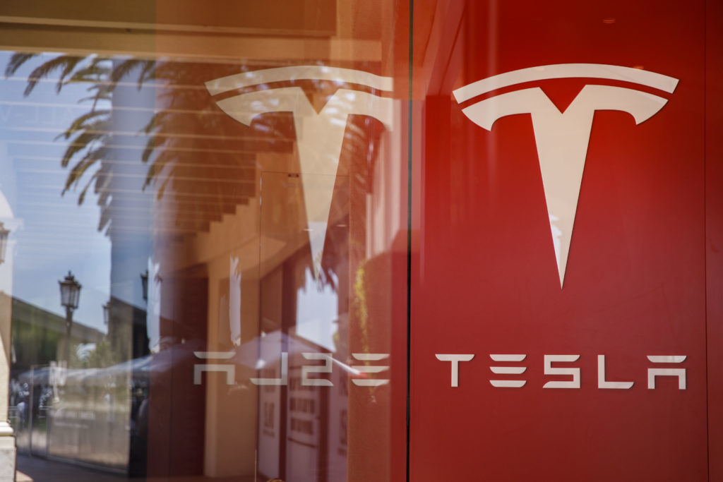 Signage is displayed at the Tesla Inc. showroom in Newport Beach, California, U.S., on Friday, July 6, 2018. Photographer: Patrick T. Fallon/Bloomberg