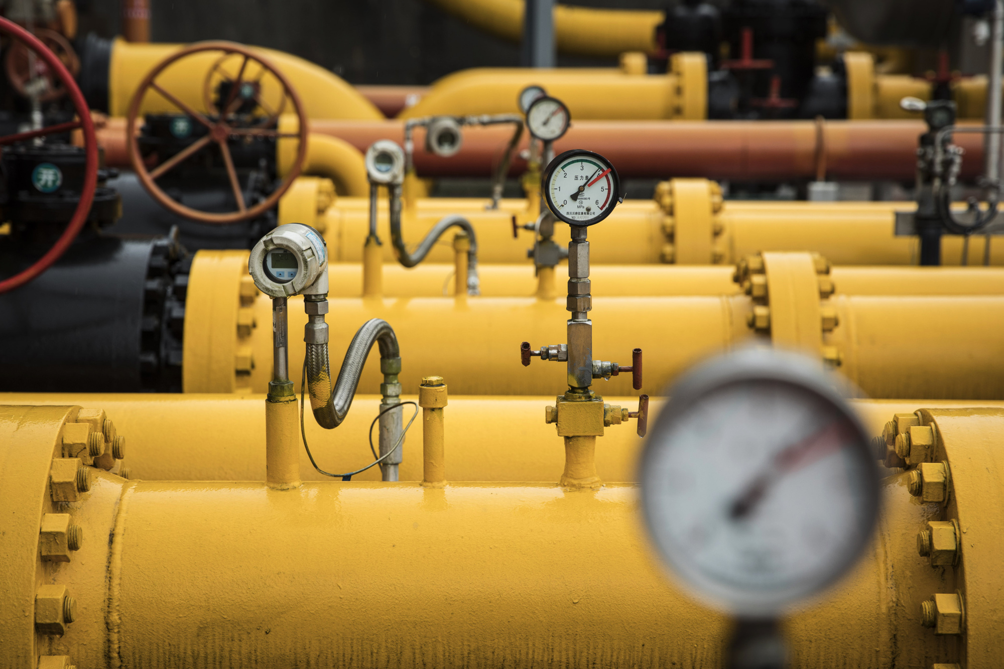 Pressure gauges sit on pipework at a shale gas collection and transfer facility at the Fuling shale gas project site, operated by Sinopec Chongqing Fuling Shale Gas Exploration and Development Co., a unit of China Petrochemical Corp. (Sinopec), in Jiaoshiba, Chongqing Municipality, China, on Wednesday, June 20, 2018. In 2013, the U.S. Department of Energy estimated China was sitting on the world's largest reserves of shale gas, almost double the U.S. and enough to theoretically supply the country for more than a century. The reserves are also deeper, harder to reach and more broken up than those in North America. Photographer: Qilai Shen/Bloomberg