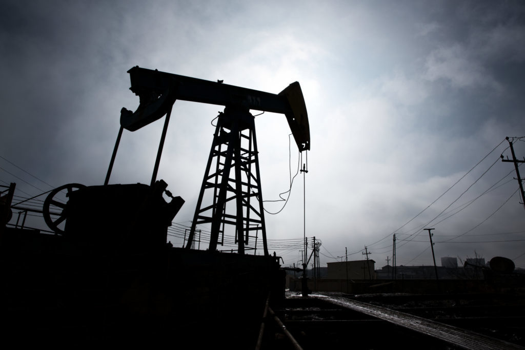 A pumpjack is silhouetted as it operates in Baku, Azerbaijan, on Sunday, March 18, 2018. Two years after descending into junk, Azerbaijan's shortest path to winning back its investment grade is by rebuilding the stash of petrodollars it raided during a recession and a banking meltdown, according to Fitch Ratings. Photograph: Taylor Weidman/Bloomberg Photographer: Taylor Weidman/Bloomberg