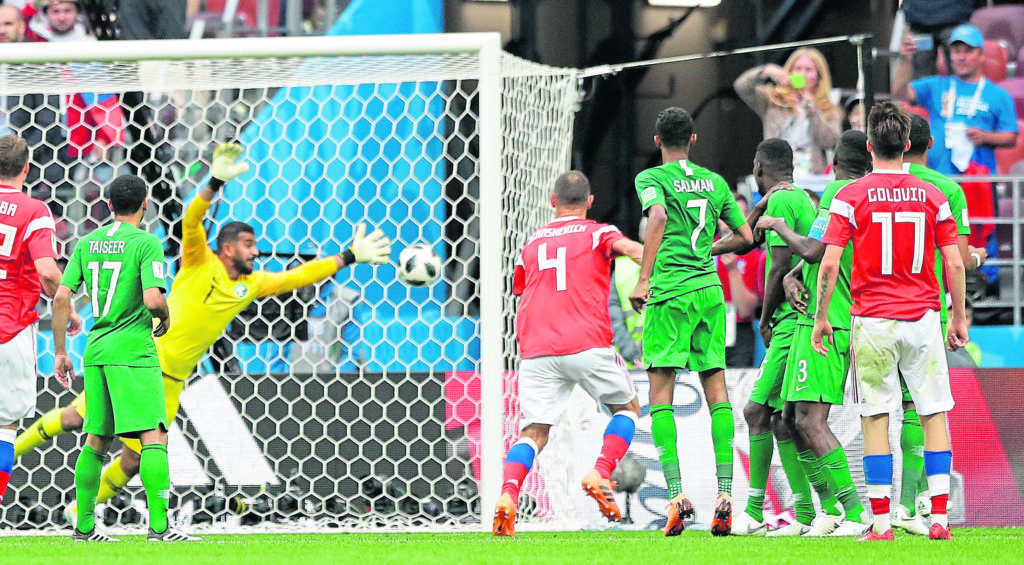 Russia’s Alexander Golovin, right, scores his side’s fifth goal during the opening World Cup match between Russia and Saudi Arabia