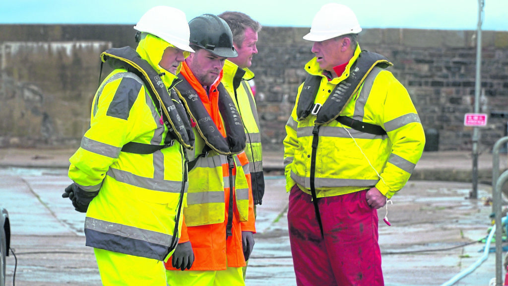 Subsea entrepreneur Mike Wilson explaining a project to employees