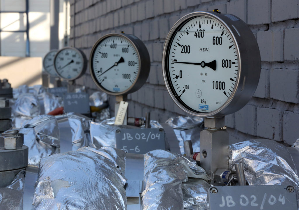 A row of manometers, a gauge for measuring gas, is seen on pipe work at the OAO Gazprom Neft oil refinery in Moscow, Russia. Photographer: Andrey Rudakov/Bloomberg