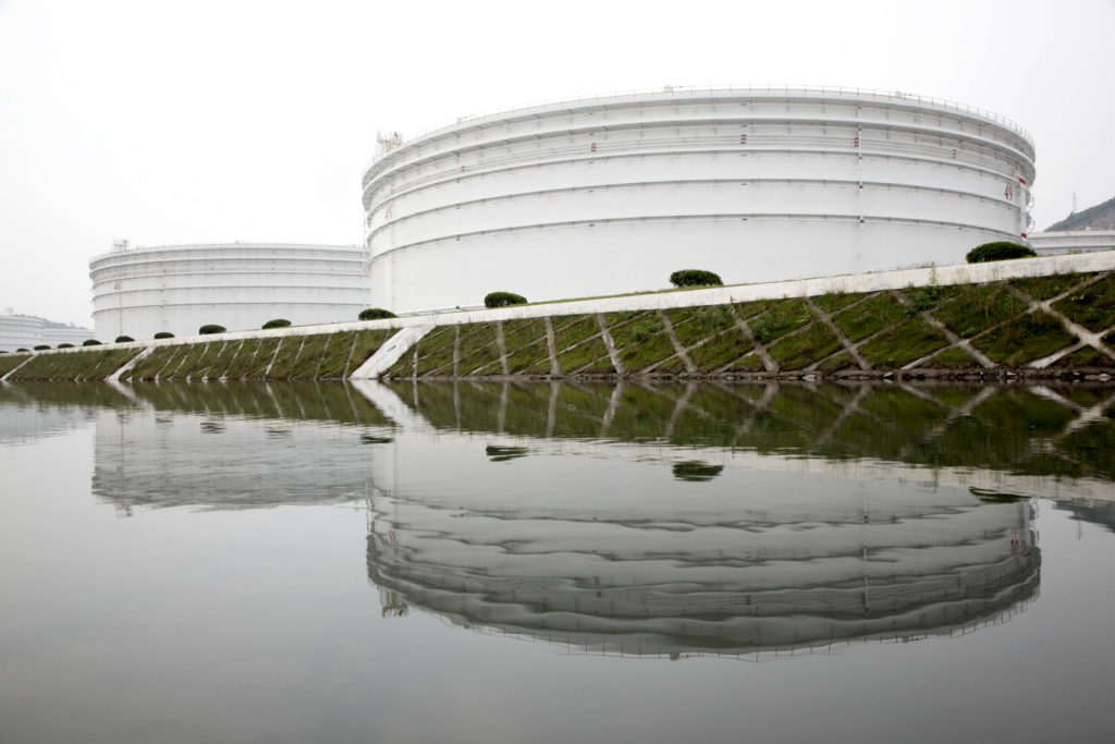 Storage tanks stand in China's strategic oil reserve complex in Zhoushan, Jiangsu province, China, on Wednesday, June 3, 2009.  Photographer: QILAI SHEN/ Bloomberg