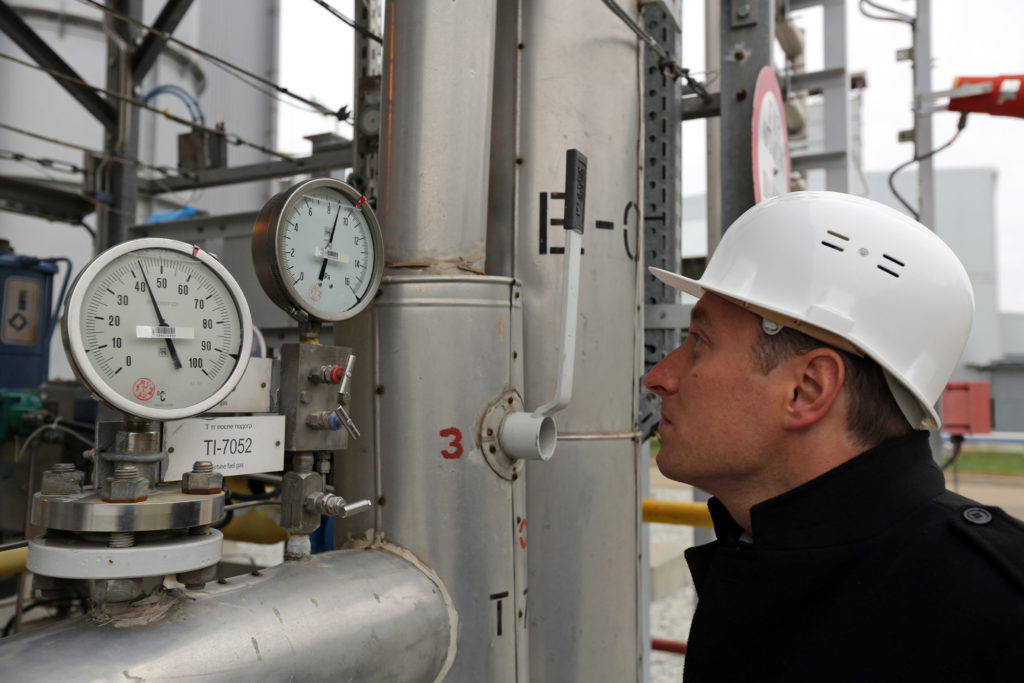 An employee checks gauges at the Beregovaya compressor station, part of the Blue Stream gas pipeline, a joint venture between OAO Gazprom and Eni SpA, in Gelendzhik, Russia. Photographer: Andrey Rudakov/Bloomberg