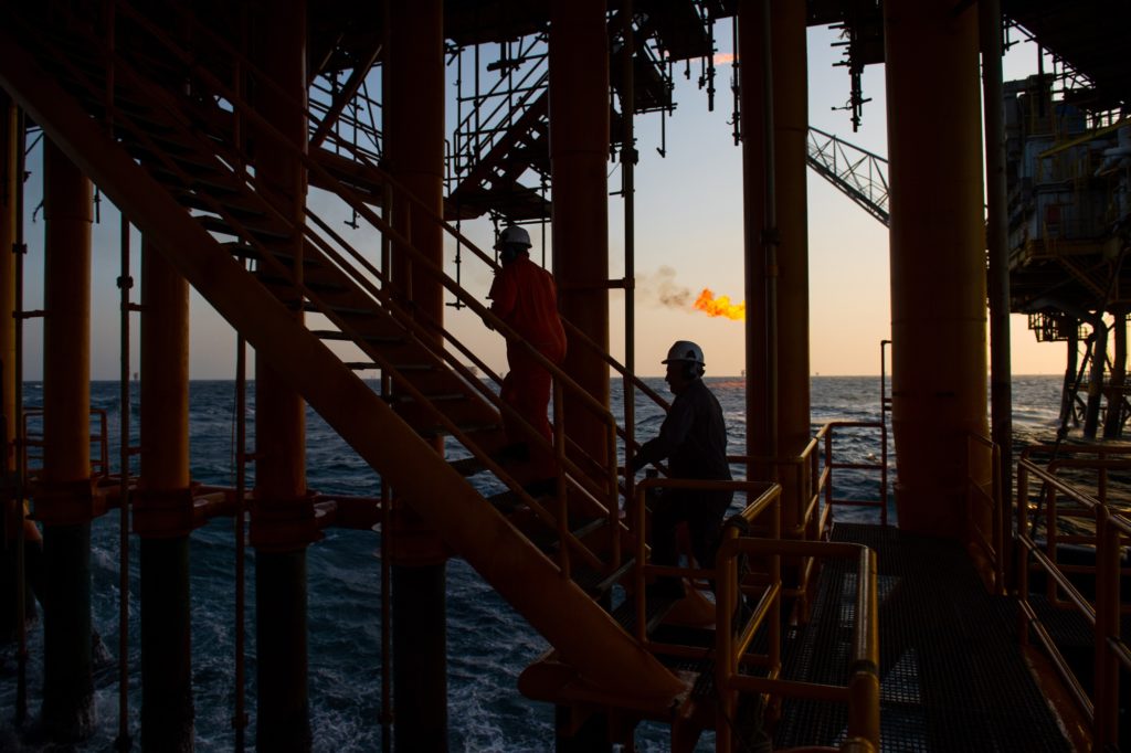 Workers climb stairs from a lower deck aboard an offshore oil platform in the Persian Gulf's Salman Oil Field, operated by the National Iranian Offshore Oil Co., near Lavan island, Iran, on Thursday, Jan. 5. 2017. Nov. 5 is the day when sweeping U.S. sanctions on Irans energy and banking sectors go back into effect after Trumps decision in May to walk away from the six-nation deal with Iran that suspended them. Photographer: Ali Mohammadi/Bloomberg