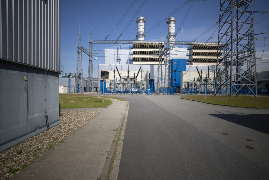 Transformer substations stand behind fences outside the coal powered power plant operated by RWE AG in Lingen, Germany. Photographer: Jasper Juinen/Bloomberg