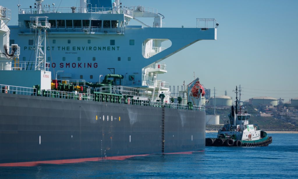 The Sea Garnet crude oil tanker is pulled by a tugboat near the El Segundo Offshore Oil Terminal in El Segundo, California, U.S. Photographer: Tim Rue/Bloomberg