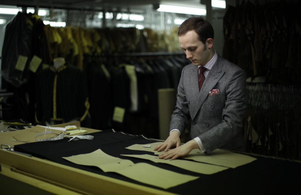 Gieves and Hawkes bespoke under cutter Richard Lawson poses for photographs at the tailor's premises on Saville Row in London
