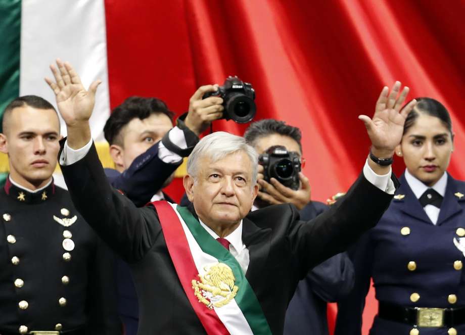 Mexico's new President Andres Manuel Lopez Obrador greets the crowd at the end of his inaugural ceremony at the National Congress in Mexico City, Saturday, Dec. 1, 2018.