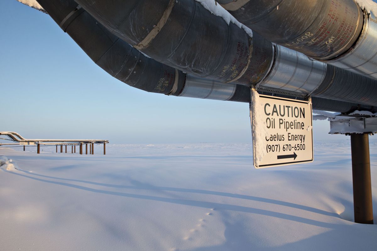 A caution sign hangs from an oil pipeline at the Caelus Energy LLC Oooguruk Development Project on the North Slope in Harrison Bay, Alaska, U.S., on Friday, Feb. 17, 2017.  Photographer: Daniel Acker/Bloomberg