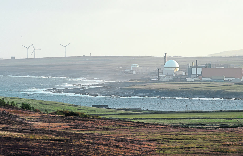 Dounreay as breakers from the Pentland Firth break on the shore.