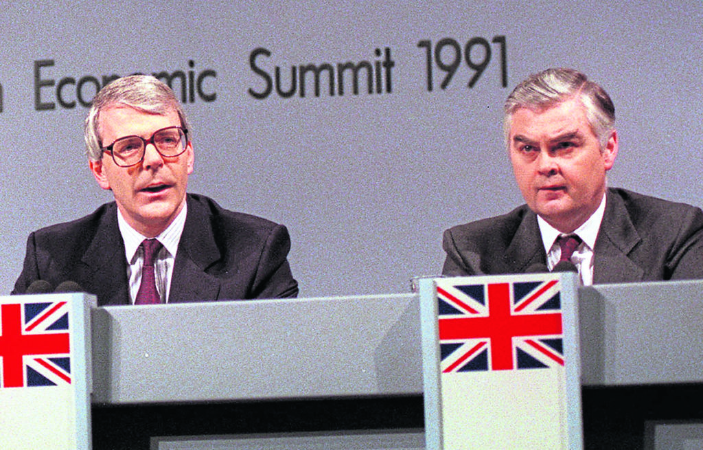 The proposal to abolish the Petroleum Revenue Tax was discussed by Prime 
Minister John Major, left, and Chancellor Norman Lamont, right