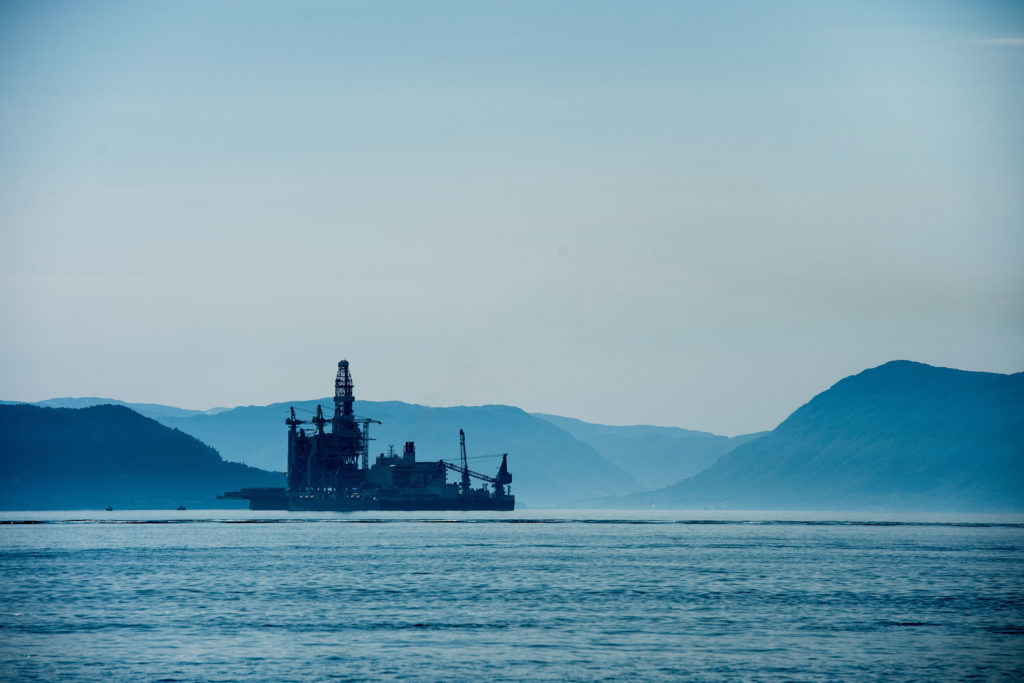 An oil drilling platform sits on board the world's largest construction vessel, the Pioneering Spirit, in the Bomla fjord near Leirvik, ahead of its transportation to the Johan Sverdrup oil field, Norway, on Friday, June 1, 2018. Equinor ASA has reduced the break-even price to below $20 a barrel in its flagship Johan Sverdrup oil project in the North Sea. Photographer: Carina Johansen/Bloomberg