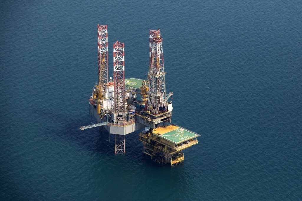 An offshore drilling platform stands in shallow waters at the Manifa offshore oilfield, operated by Saudi Aramco, in Manifa, Saudi Arabia, on Wednesday, Oct. 3, 2018. Saudi Aramco aims to become a global refiner and chemical maker, seeking to profit from parts of the oil industry where demand is growing the fastest while also underpinning the kingdoms economic diversification. Photographer: Simon Dawson/Bloomberg