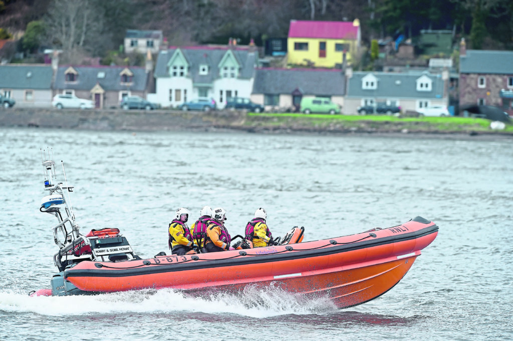 Coastguard Helicopter from Inverness and North Kessock Lifeboat search the waters of the Beauly and Inverness Firths close to the Kessock Bridge.