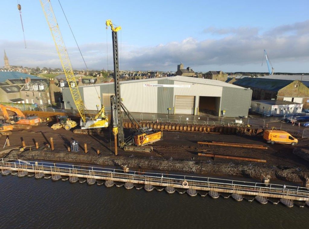 Contractors installing steel casing pipe supplied by John Lawrie Tubulars for use as piling as part of Montrose Port upgrade.