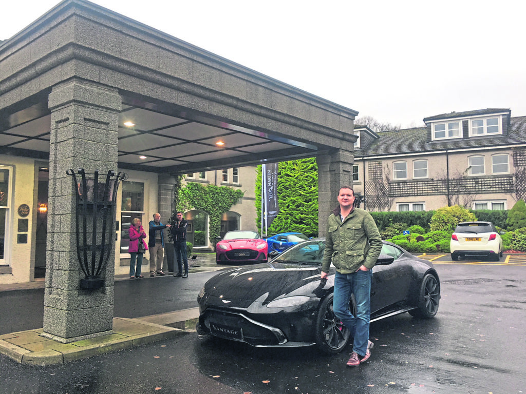 Roddy McAllister with an Aston Martin outside the Marcliffe in Aberdeen