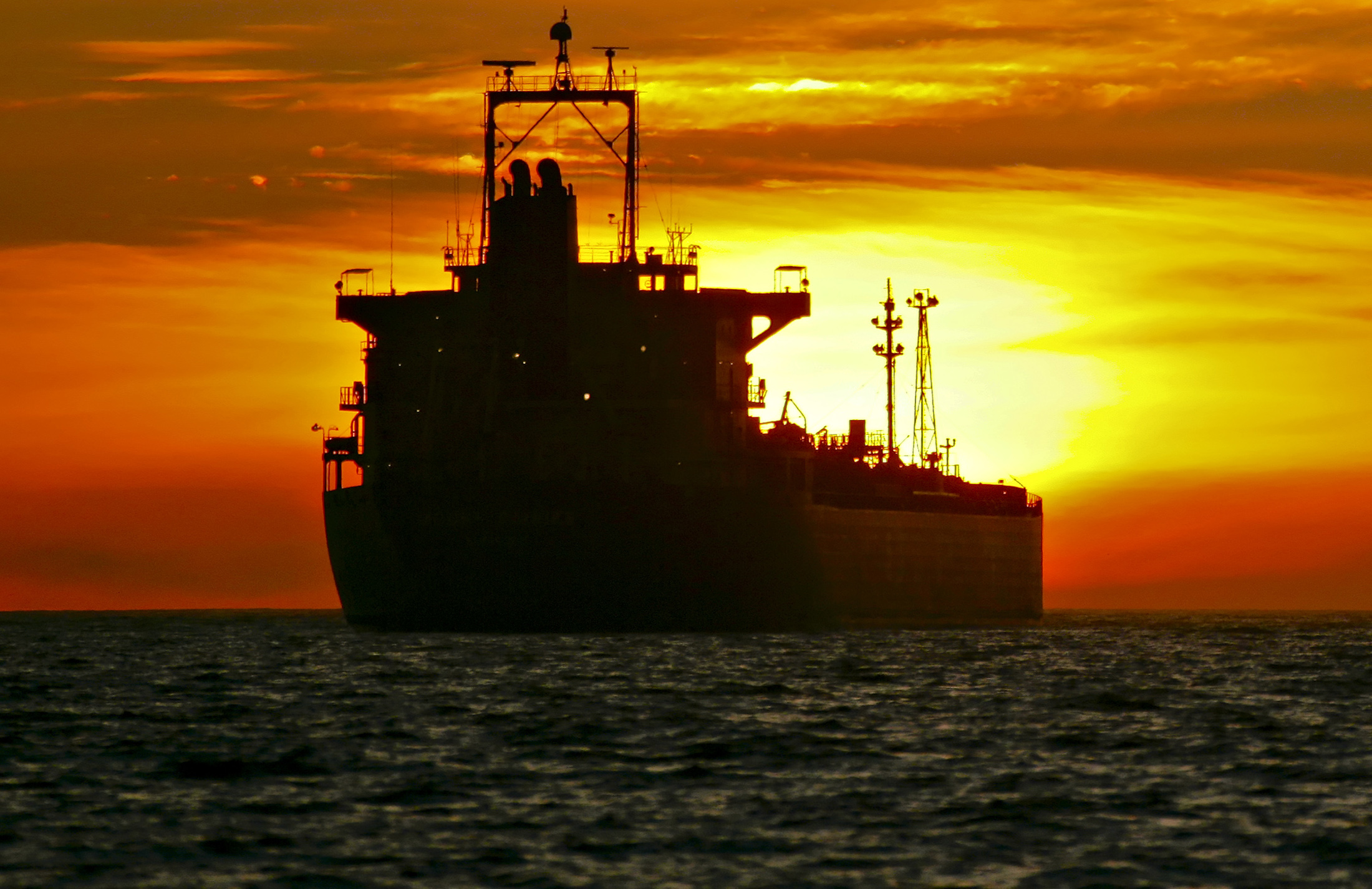An oil tanker is anchored near the Port of Long Beach, California, U.S. Photographer: Tim Rue/Bloomberg