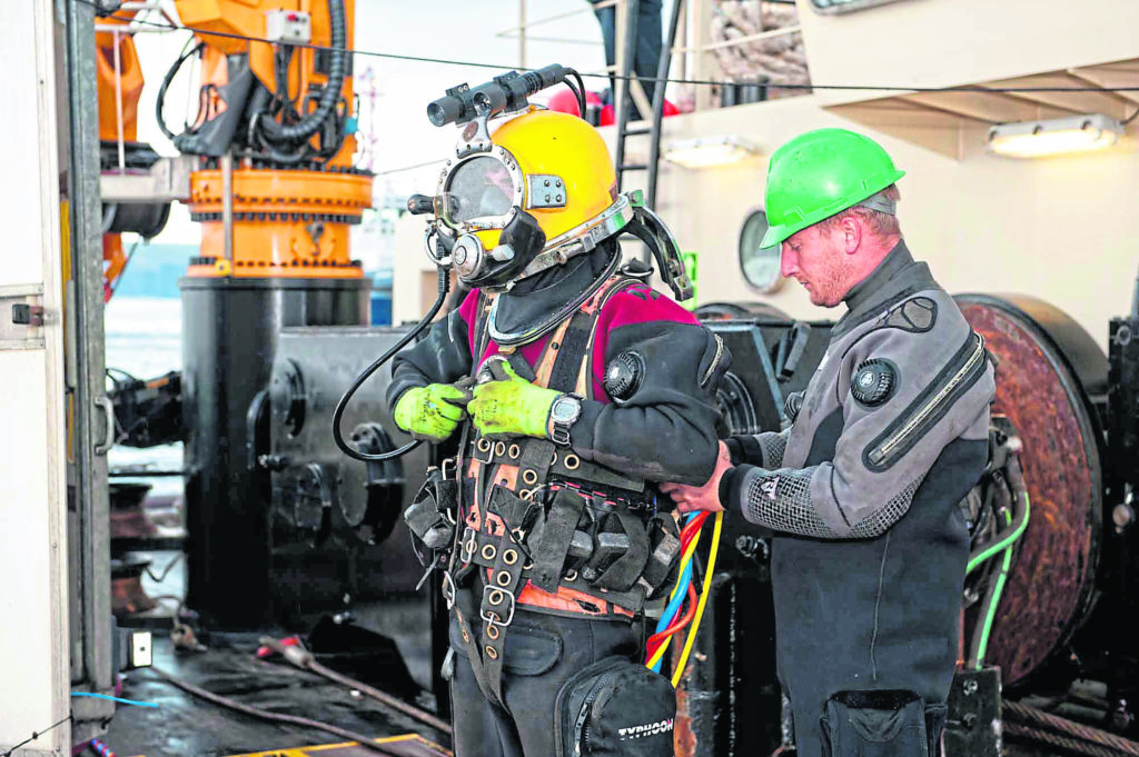 OFFSHORE WORK: A Leask Marine diver has his equipment checked over